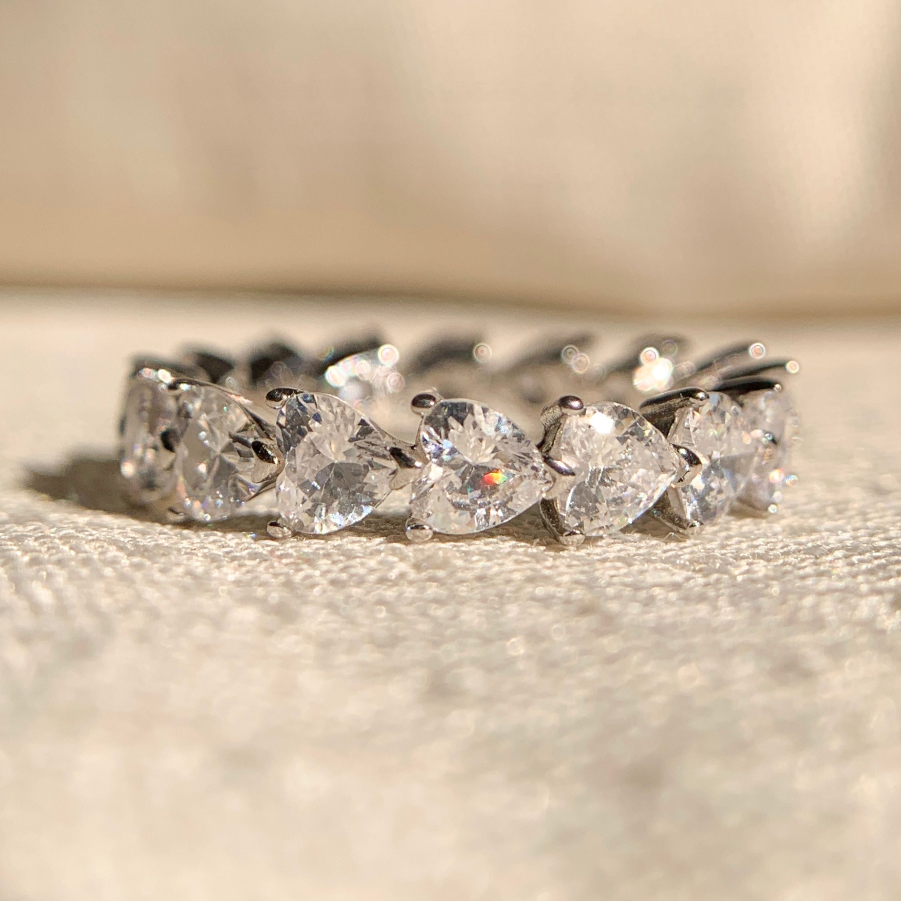 Moissanite heart shaped diamond band in white gold for women